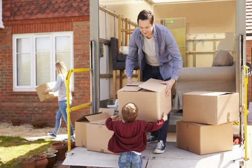 Hackneywick removals staff using careful lifting techniques during a move