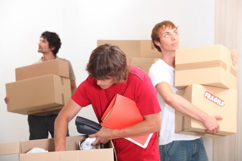 Professional movers loading furniture for a Hackney Wick removal